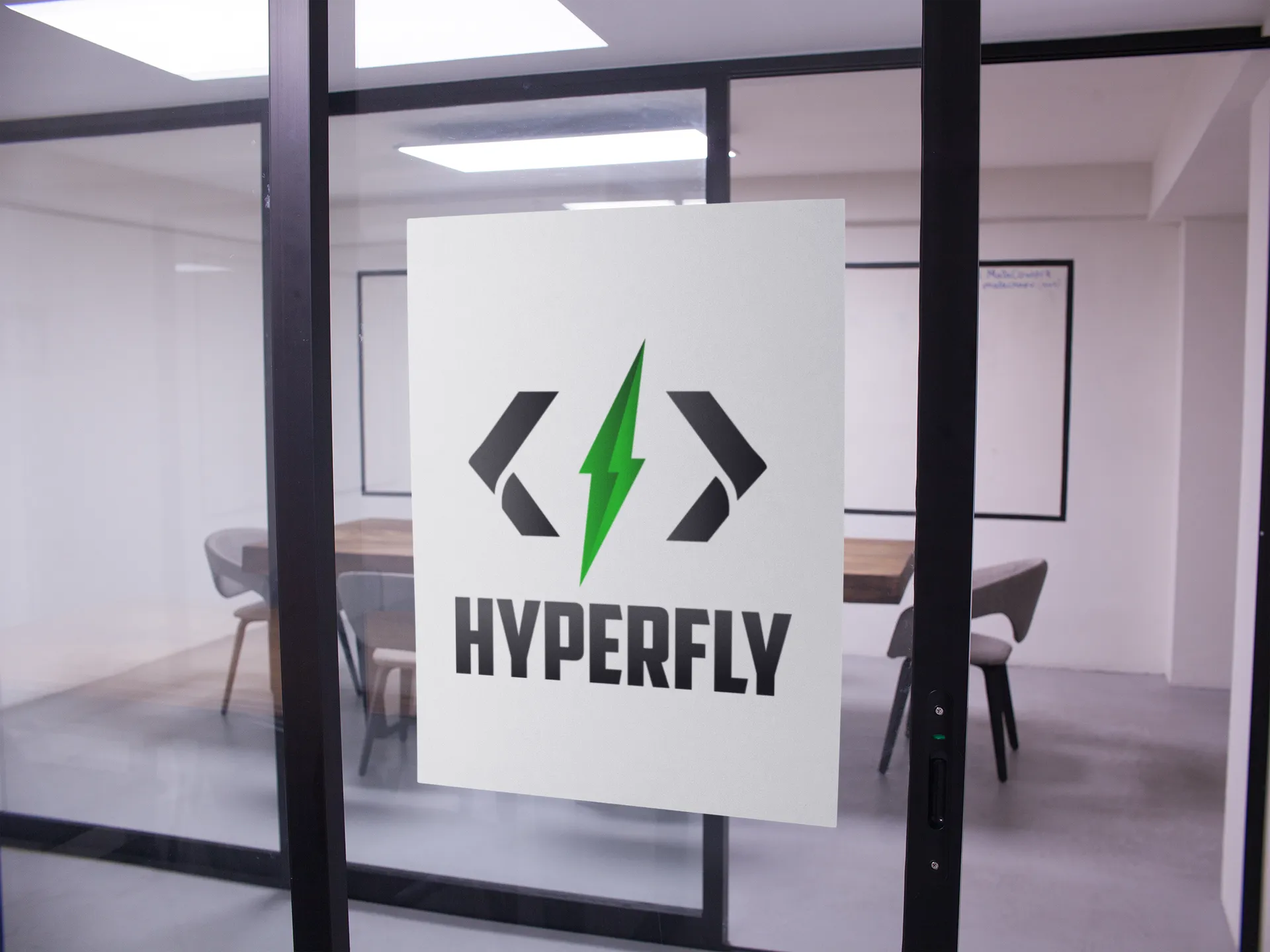 The Hyperfly logo on the glass door of a conference room.